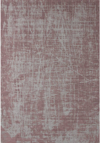 A textured washable rug carina in muted rose pink with a distressed grid pattern perfect for easy care spaces