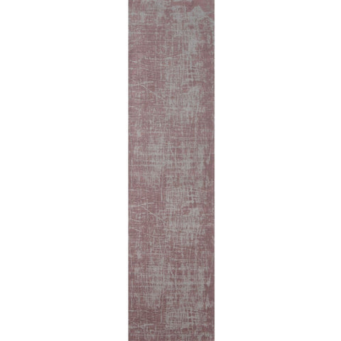 A long washable rug carina with a faded mauve base and distressed gray patterns perfect for cozy spaces