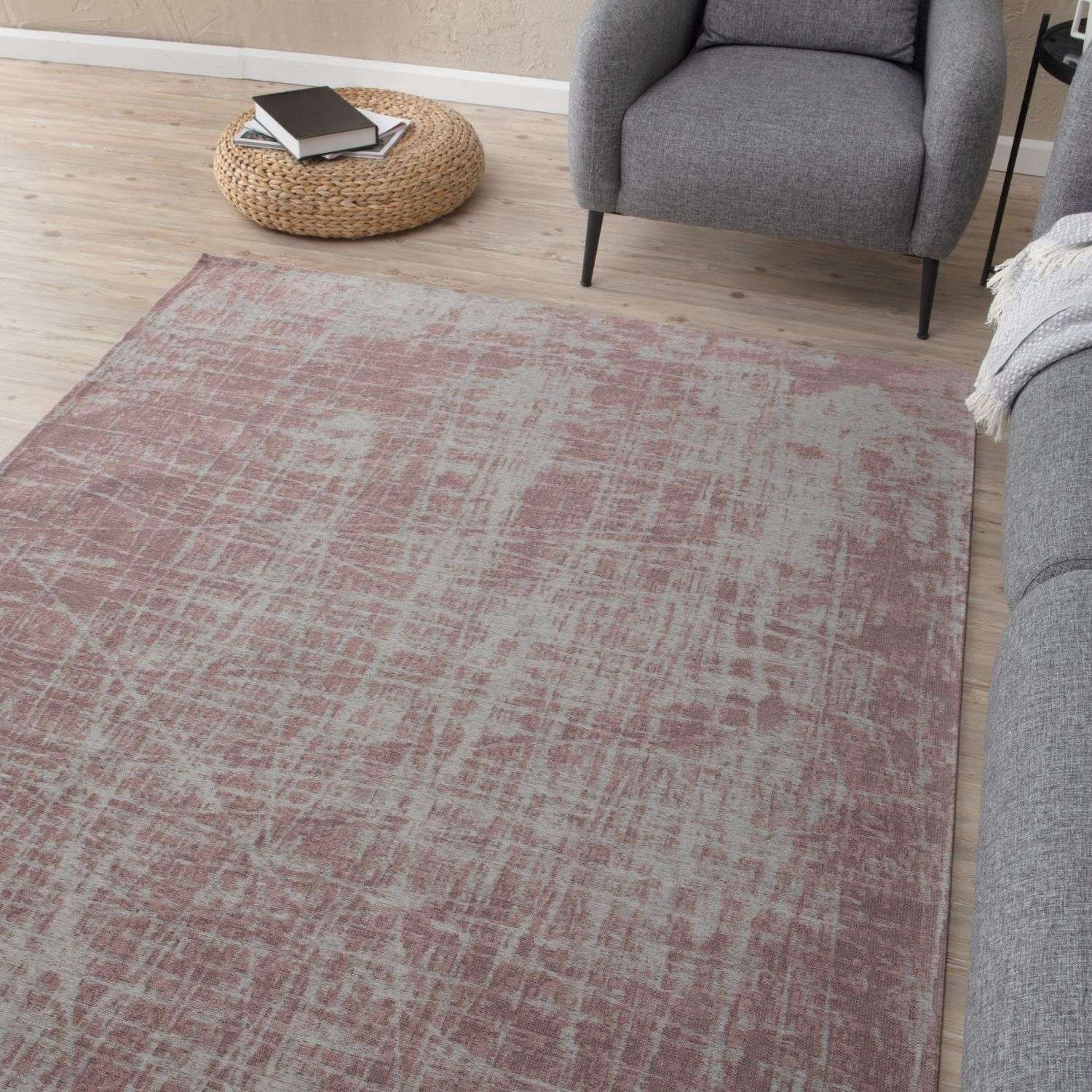 A washable rug carina in dusty rose and gray with a distressed pattern and textured weave perfect for any room