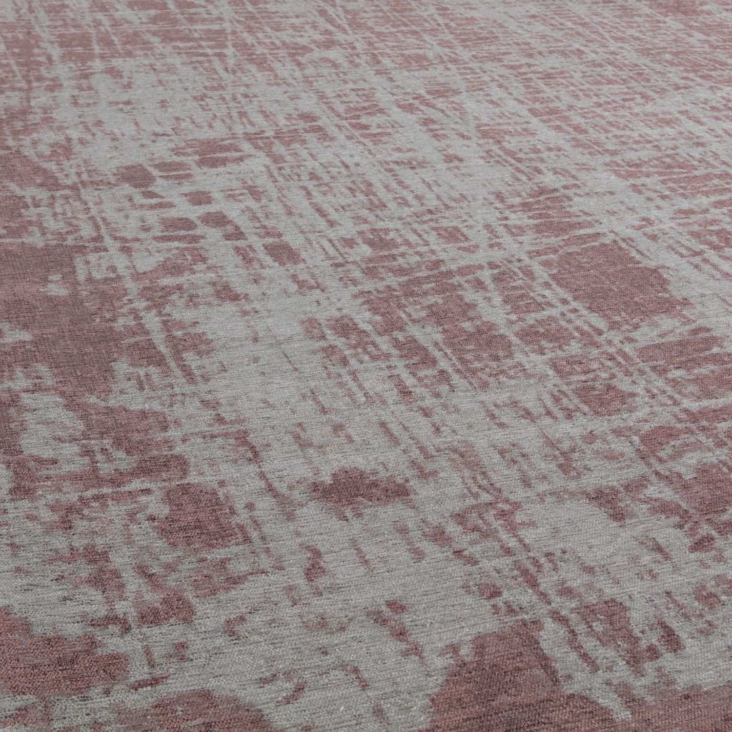 A soft pink and gray textured woven washable rug carina perfect for stylish easy-care spaces