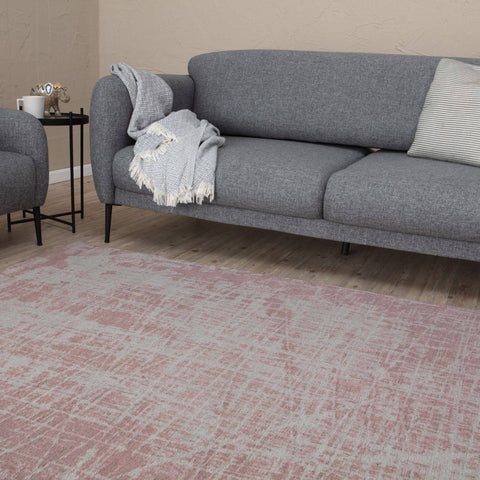 Soft pink and white abstract patterned washable rug carina pink designed for easy cleaning and durability