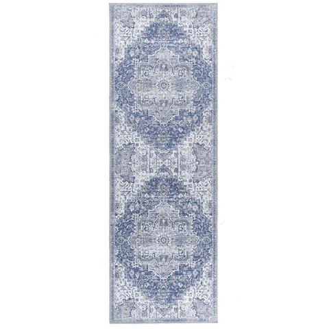 A long rectangular washable rug eterna blue with a vintage-inspired pattern in shades of blue and gray