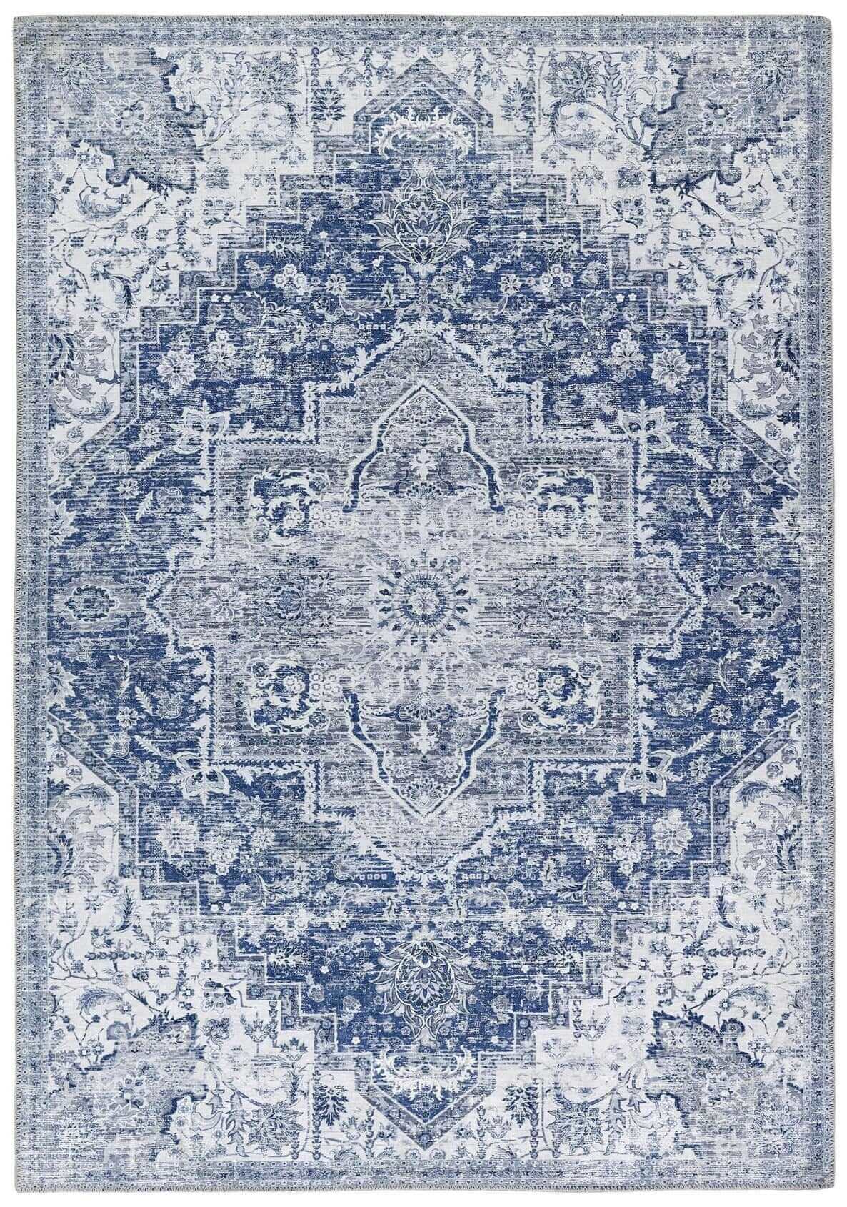 A vintage-inspired washable rug eterna blue with intricate blue and gray floral and geometric patterns