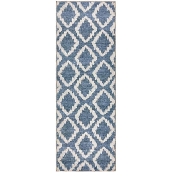 Blue and white ikat patterned washable runner rug with textured woven look featuring eterna diamond design