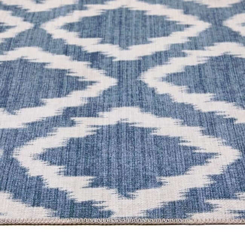 Blue and white washable rug with woven texture featuring the eterna diamond design geometric pattern
