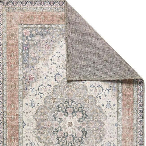 Antique-style washable area rug with a faded eterna medallion design in muted pink gray and cream tones