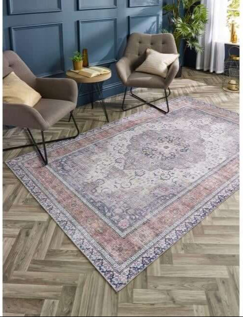 Vintage-style washable rug with eterna medallion design in faded purples and pinks with a distressed pattern