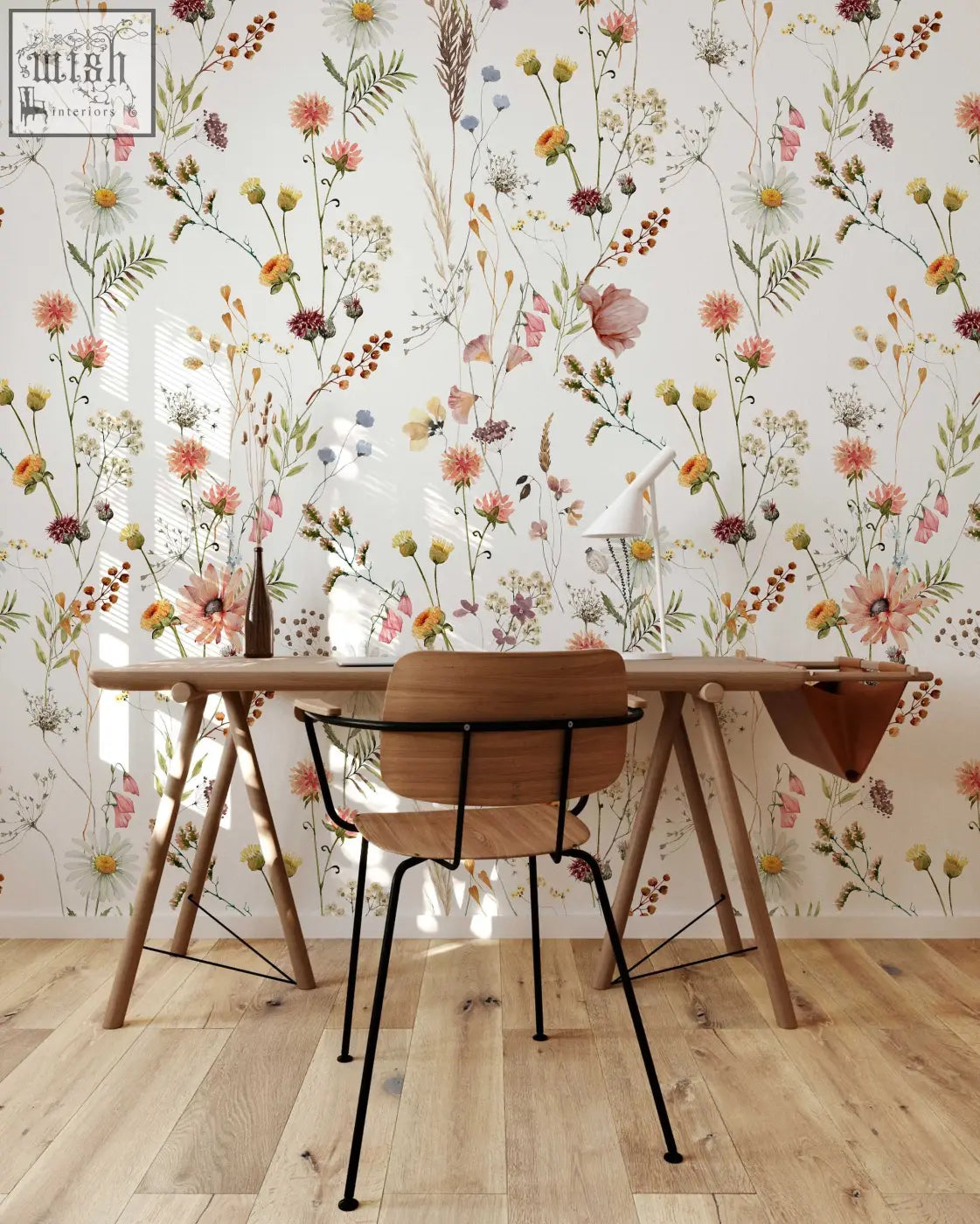 Wooden trestle desk with black metal legs and chair against soft botanical field floral wallpaper for living space