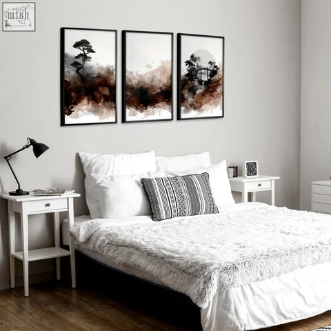 Set of three framed watercolour paintings featuring japanese landscape inkblot art in brown and gray tones