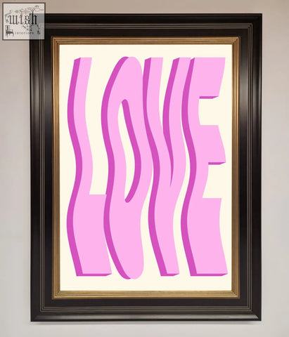 A pink framed poster with the word love in bold wavy pink letters on a cream background for wall decor