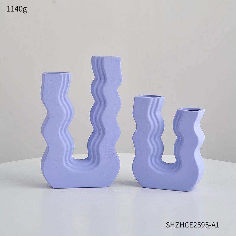 Set of four lavender ceramic wavy wonder vases with sculptural designs perfect for stylish home décor