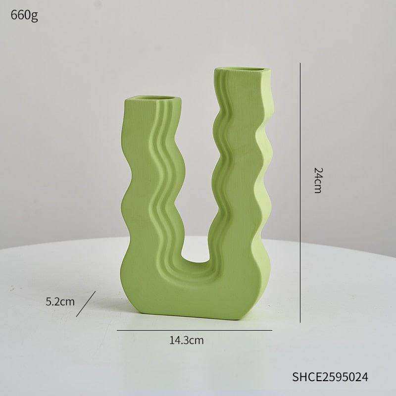 A modern light green ceramic wavy wonder vase with u-shaped design and two separate openings