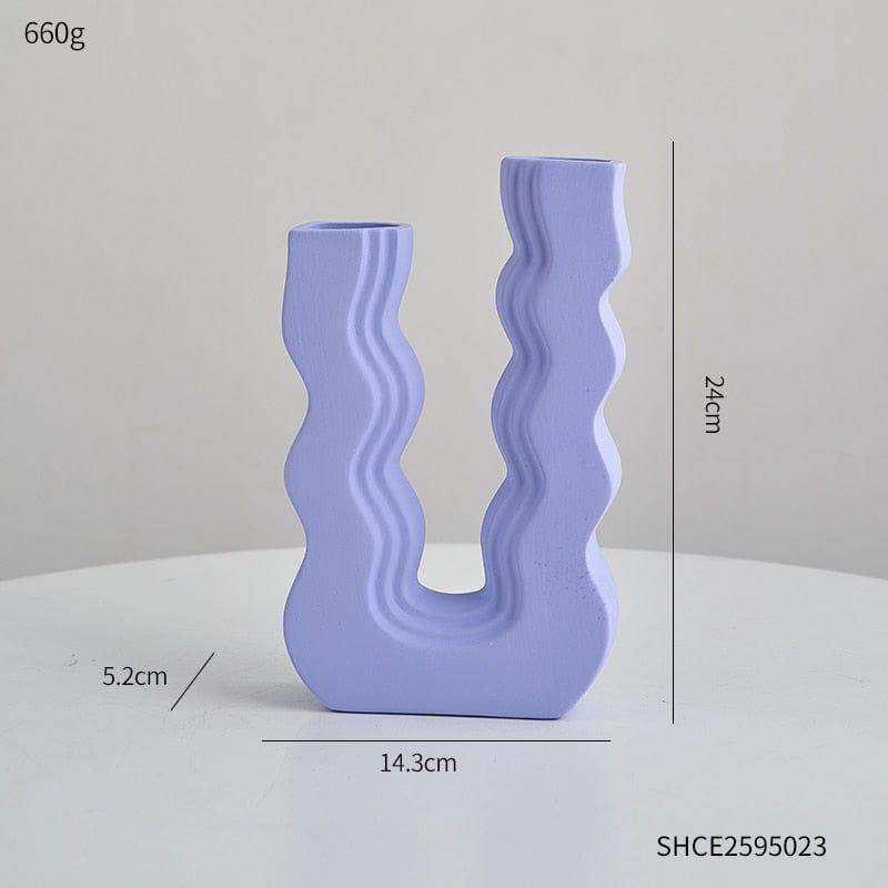 A modern light purple ceramic wavy wonder vase with a u-shaped design and two asymmetrical openings