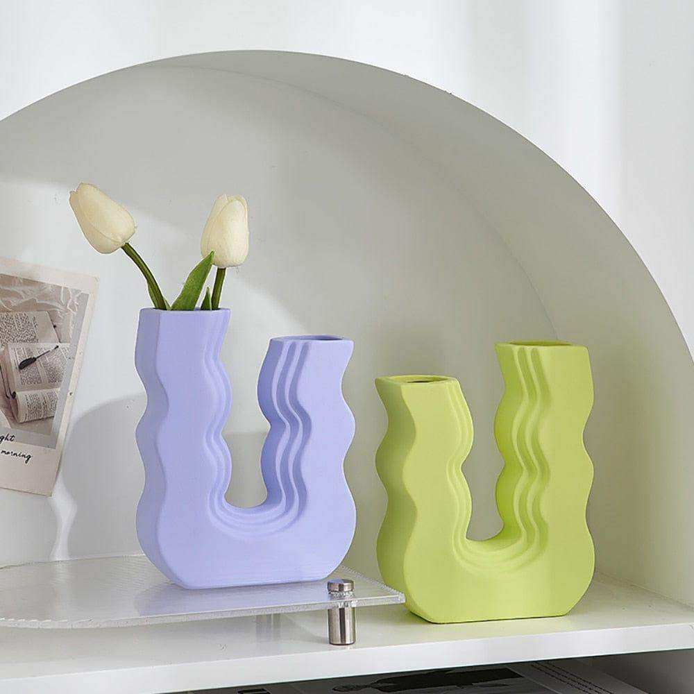 Pastel purple and lime green ceramic wavy wonder vases with unique u-shaped designs perfect for home decor