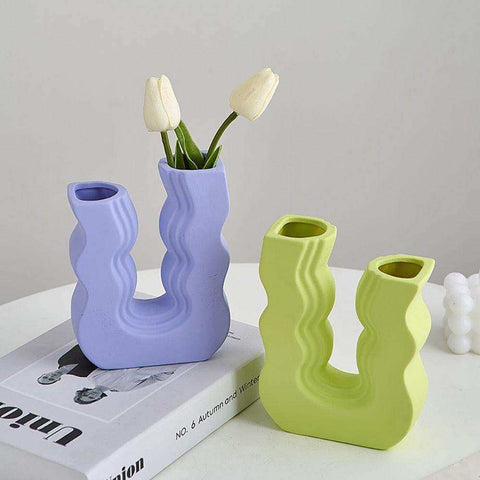 Pastel purple and lime green ceramic wavy wonder vases with u shaped designs perfect for home decor