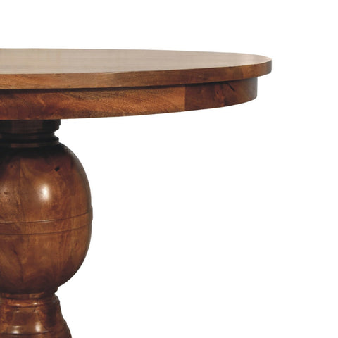 Wentworth round dining table with rich warm-toned polished wood top and ornate turned pedestal base
