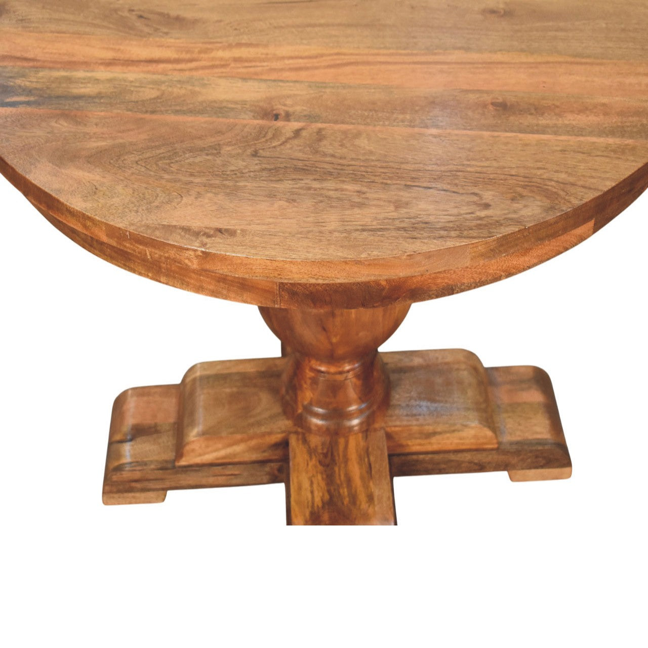 Wentworth round dining table with a rustic round wooden top and intricate carved base in warm natural finish