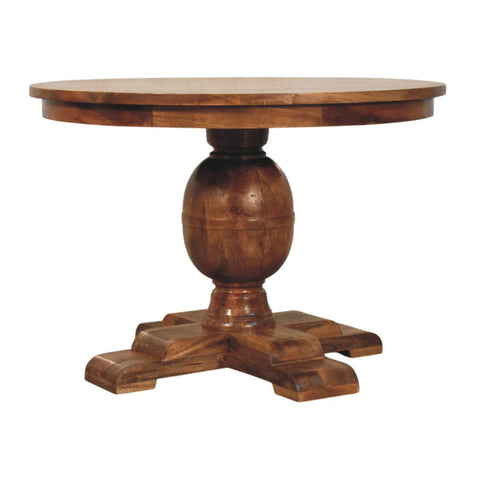 Wentworth round dining table with warm brown wooden finish and ornate carved pedestal base