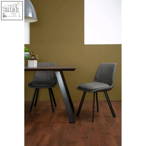Gray upholstered dining chair with black metal legs from westford dining set in modern style