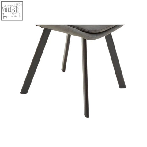 Modern gray upholstered chair with sleek black metal legs part of westford rectangle dining table with 6 chairs set