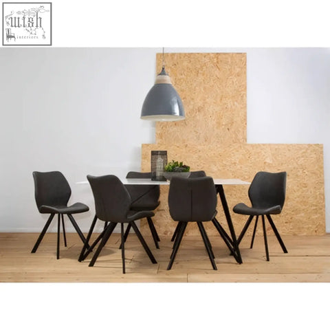 Modern black dining chairs with slender metal legs in a marble effect 7pc dining set with sleek minimalist design