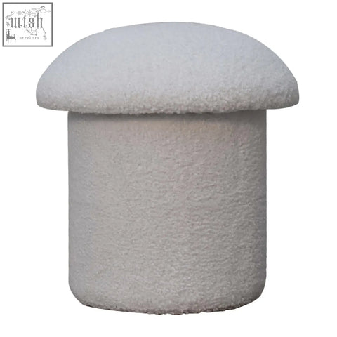 A plush white boucle mushroom footstool with soft textured fabric in an off-white color perfect for lounging