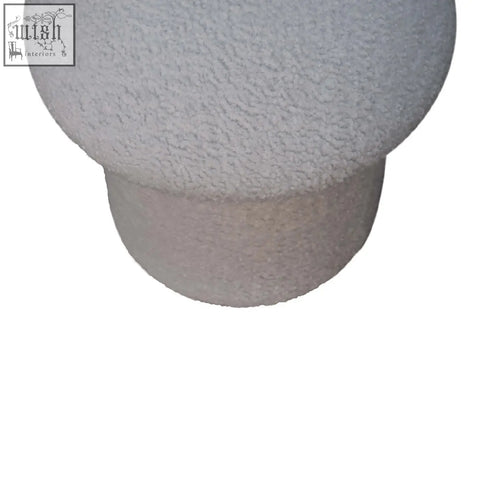 White boucle mushroom footstool with plush texture, rounded top, and cylindrical base for cozy seating