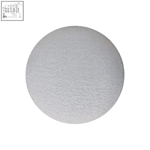 White boucle mushroom footstool with a white textured circular boucle disc top for cozy seating and decor