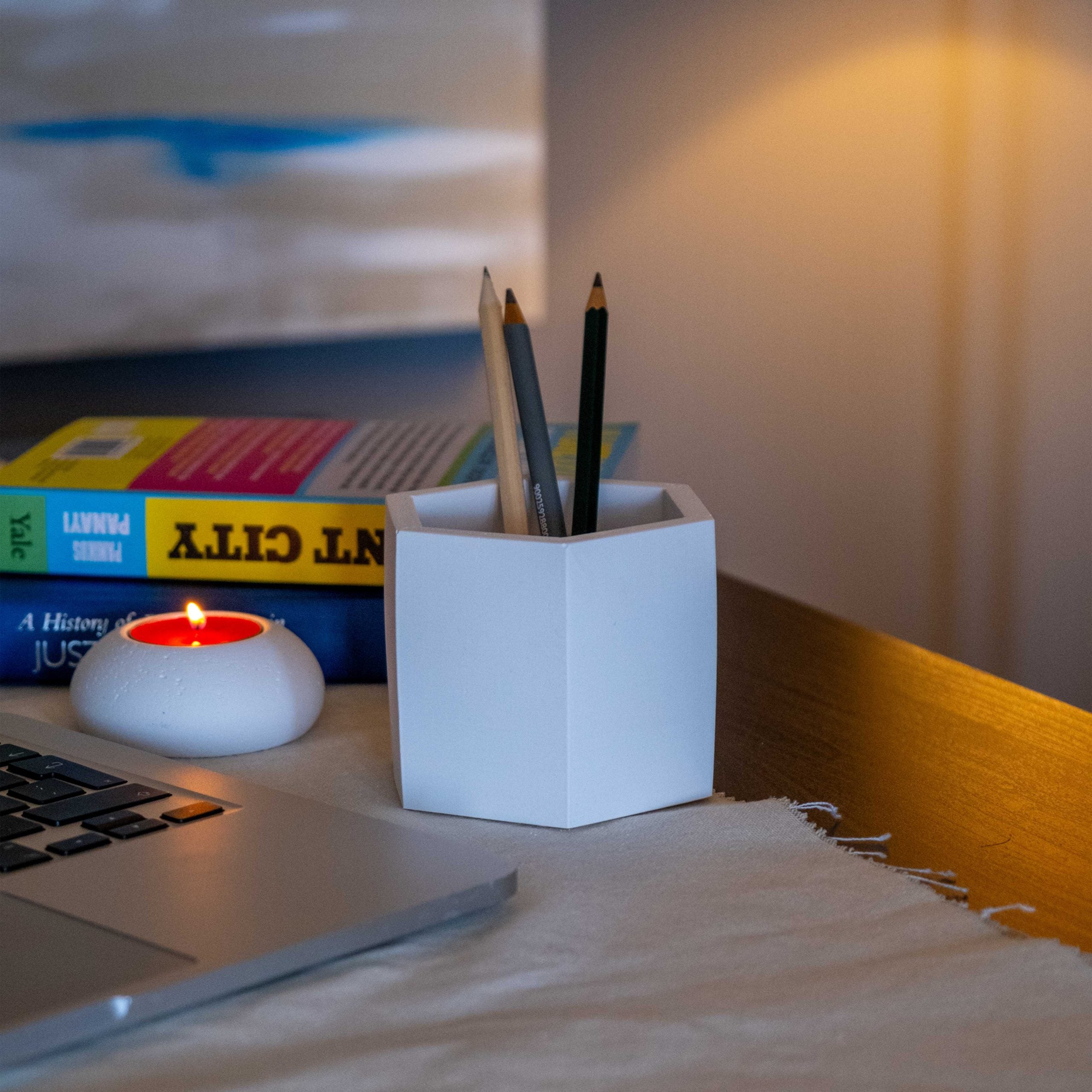 White concrete honeycomb pot pencil holder with a white hexagonal design for stylish desk organization