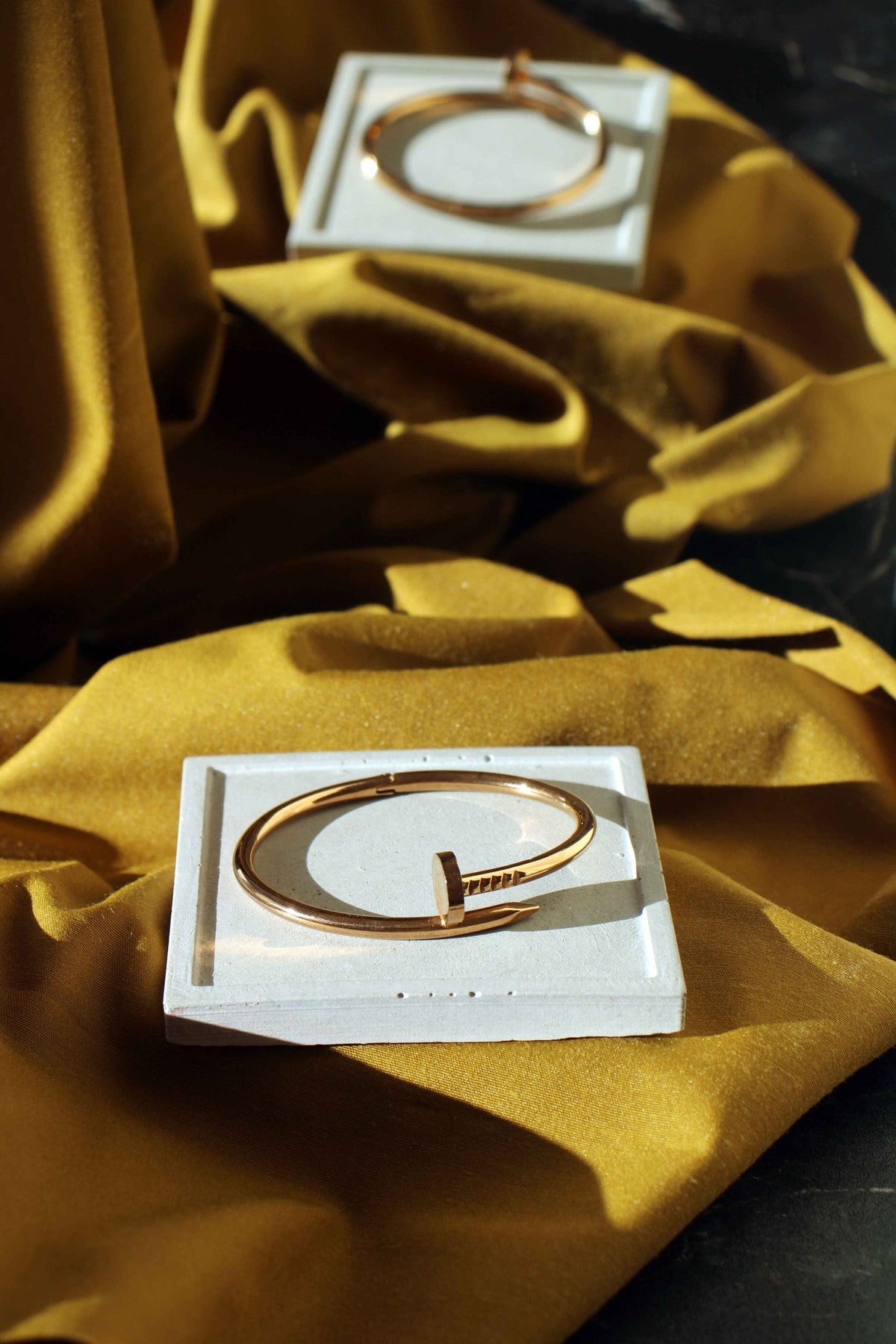 White concrete square jewellery holder with a rose gold needle clasp bangle handmade concrete great gift idea