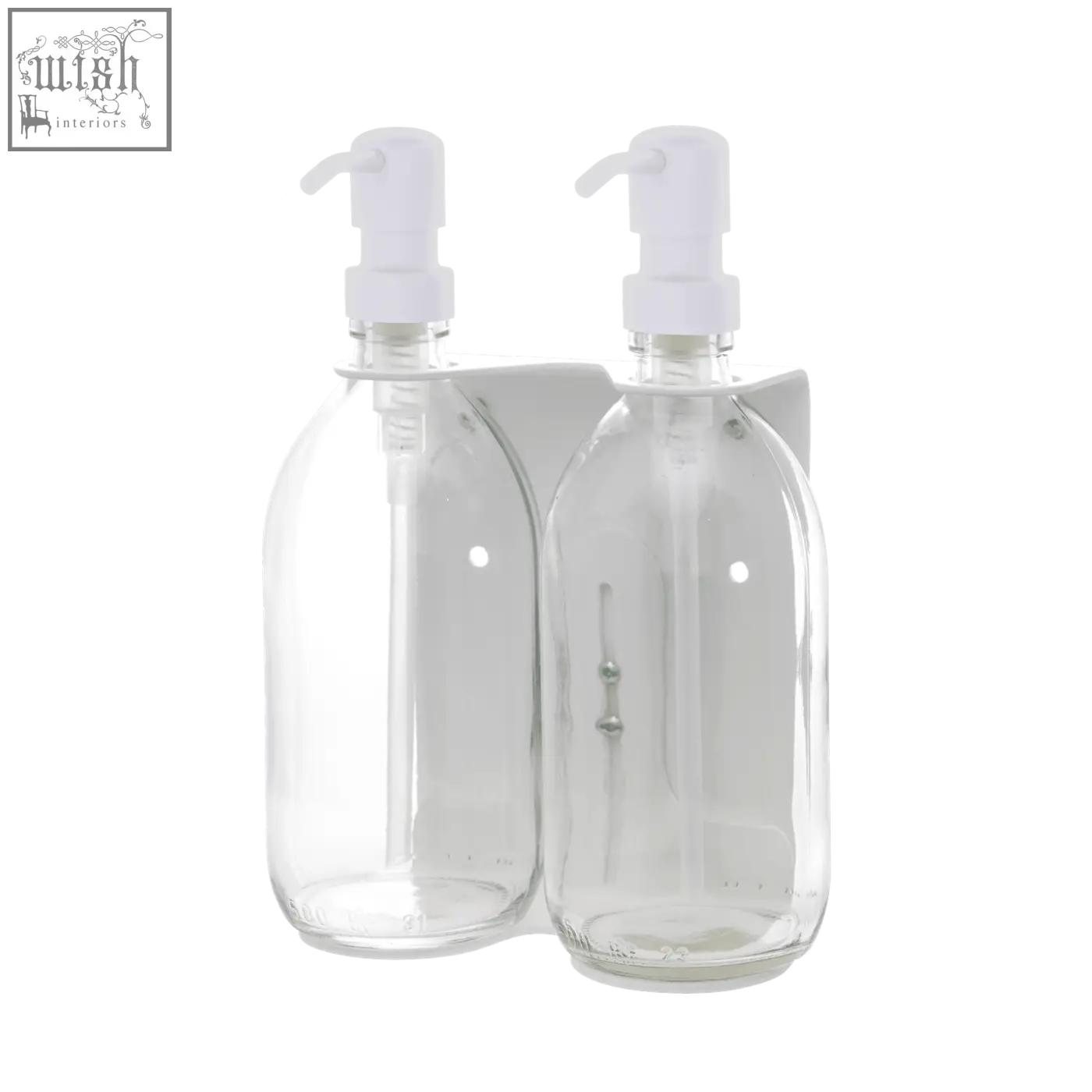 White double wall-mounted soap dispenser with clear glass bottles and white pump tops on a matching holder