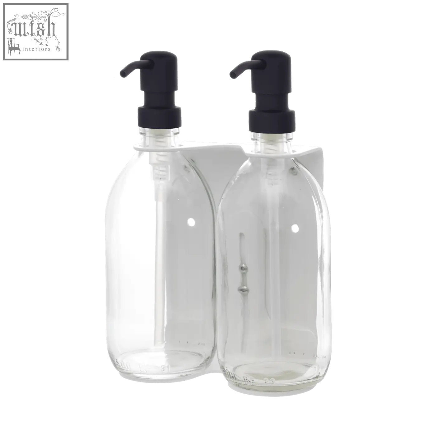 White wall mounted soap dispenser with clear glass bottles and black pump tops on a white bracket