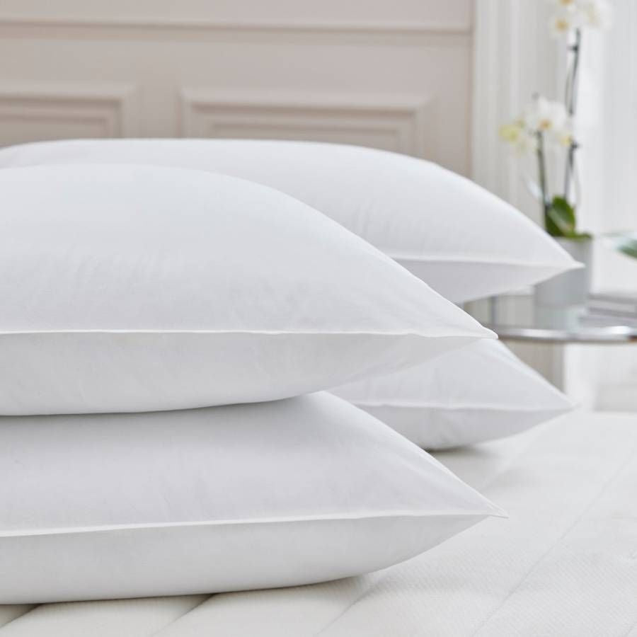 White duck down white cotton pillowcases with crisp edges and subtle sheen for a comfy sleeping style