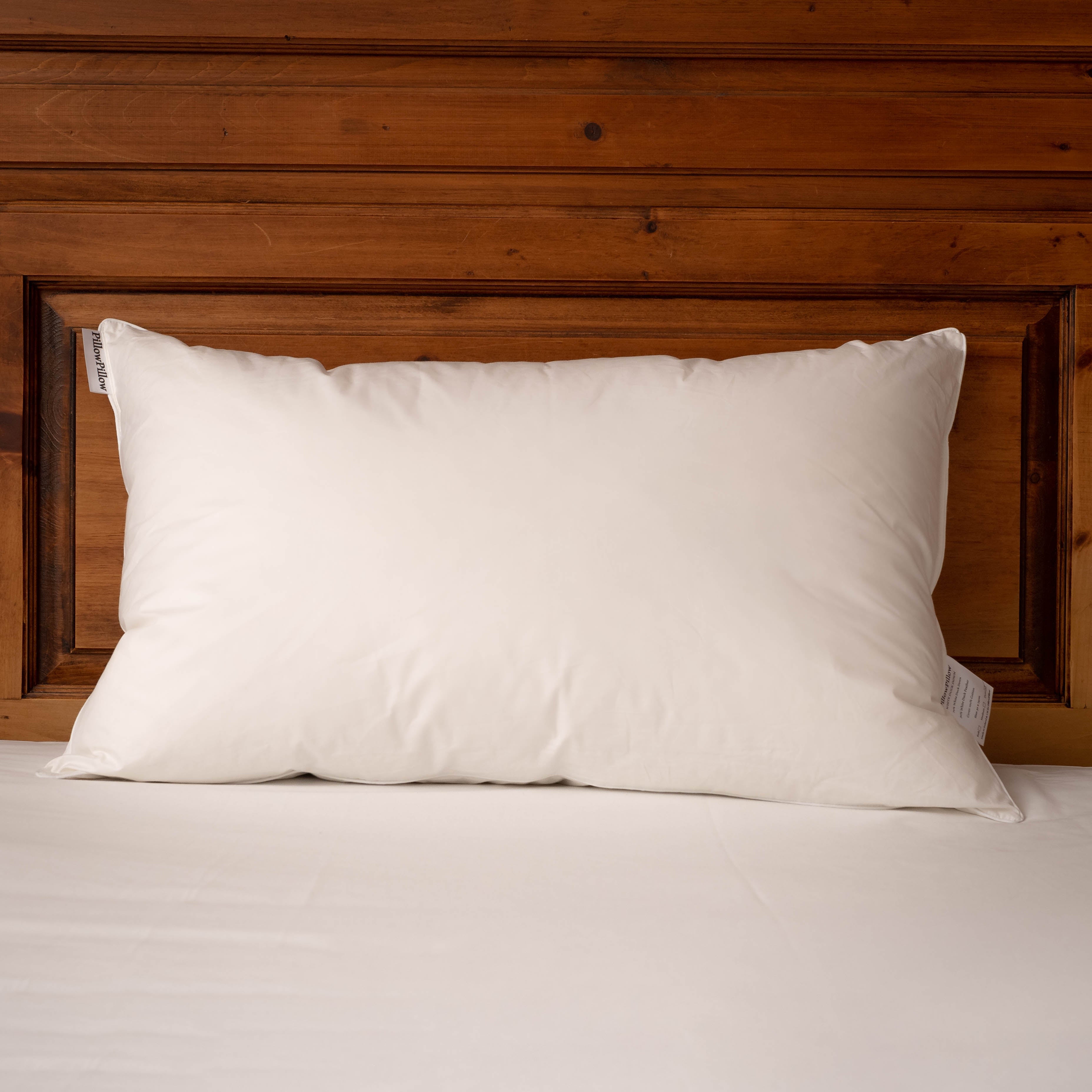 White duck down pillow with a smooth soft fabric cover perfect for a cozy sleeping style