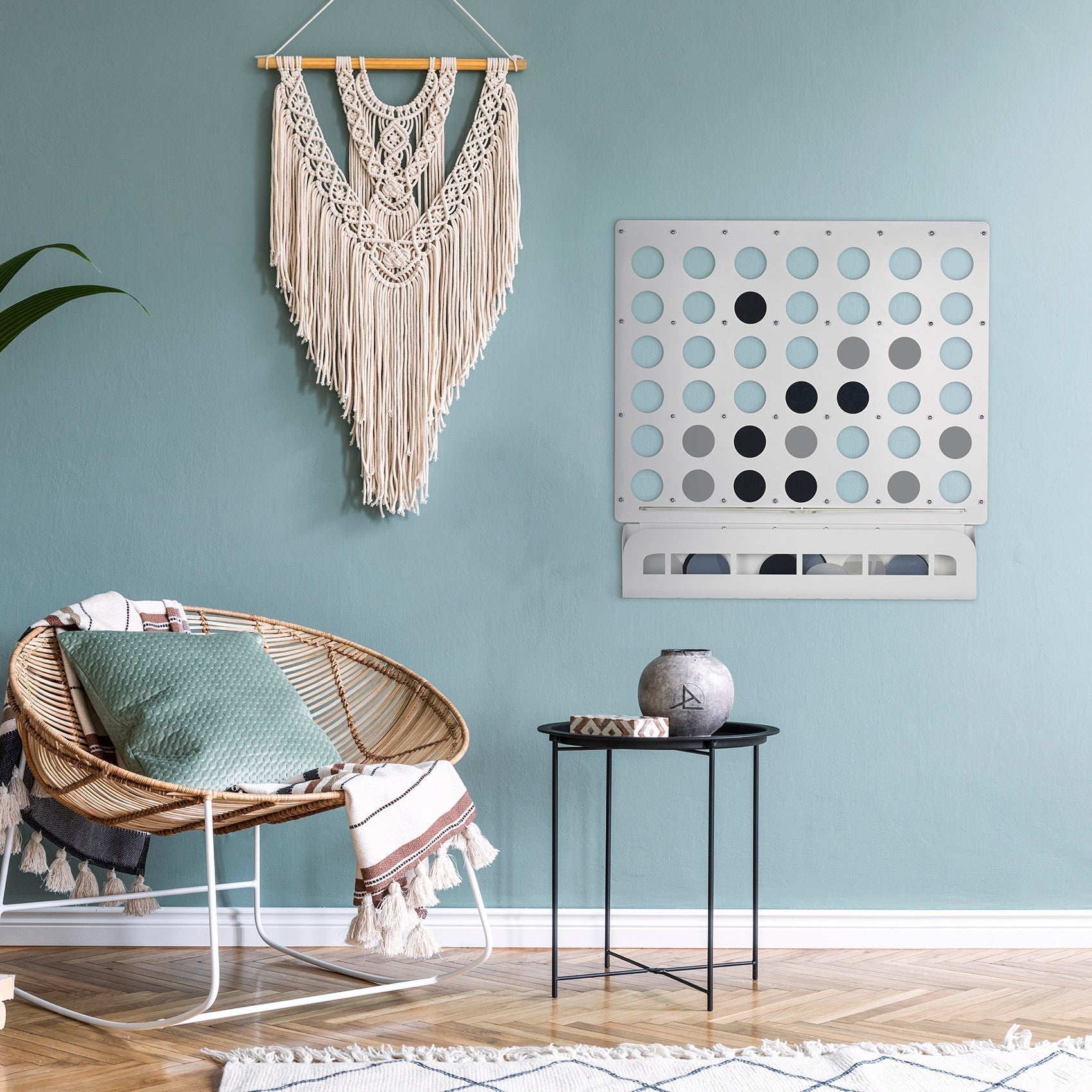 White metal wall-mounted connect four game board with circular holes and tray for discs suitable for all age ranges