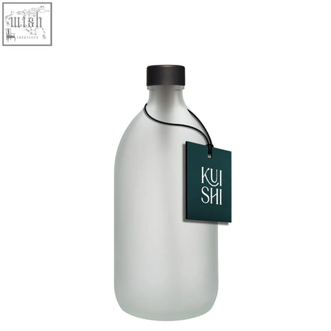 White glass bottle with frosted glass, black screw-top cap, and dark green kui shi tag, perfect glass bottle option