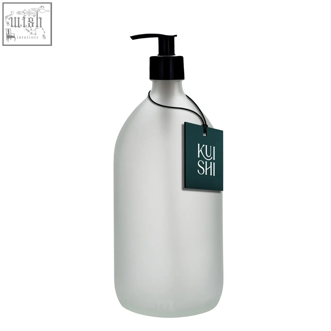Frosted white glass pump bottle with black dispenser and dark green kui shi tag in white glass pump design