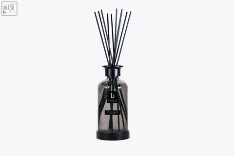 Black reed diffuser in a sleek gray glass bottle with minimalist label from the home collection premium xxl refill