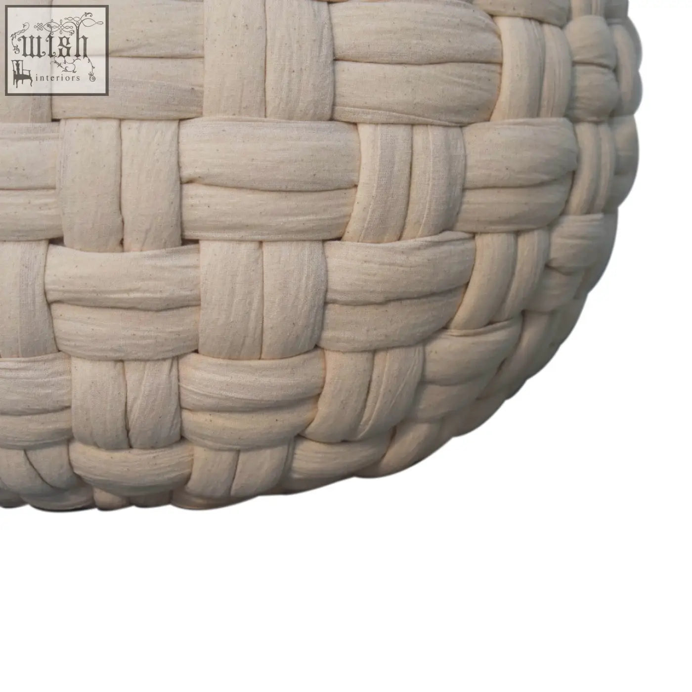 Beige woven basket with textured interlaced pattern on a white tube footstool for stylish storage and seating