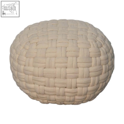 Cream-colored round white tube footstool made of thick woven fabric strips in a tight basketweave pattern