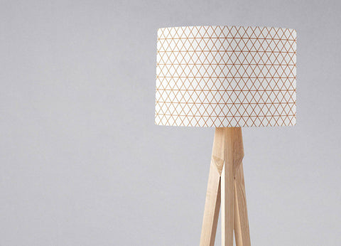 Minimalist tripod table lamp with white fabric shade featuring copper lines design and light wood legs inch diameter