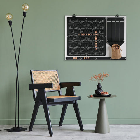 Black cane chair with woven natural rattan back and seat perfect for players in white words wall game age range seating