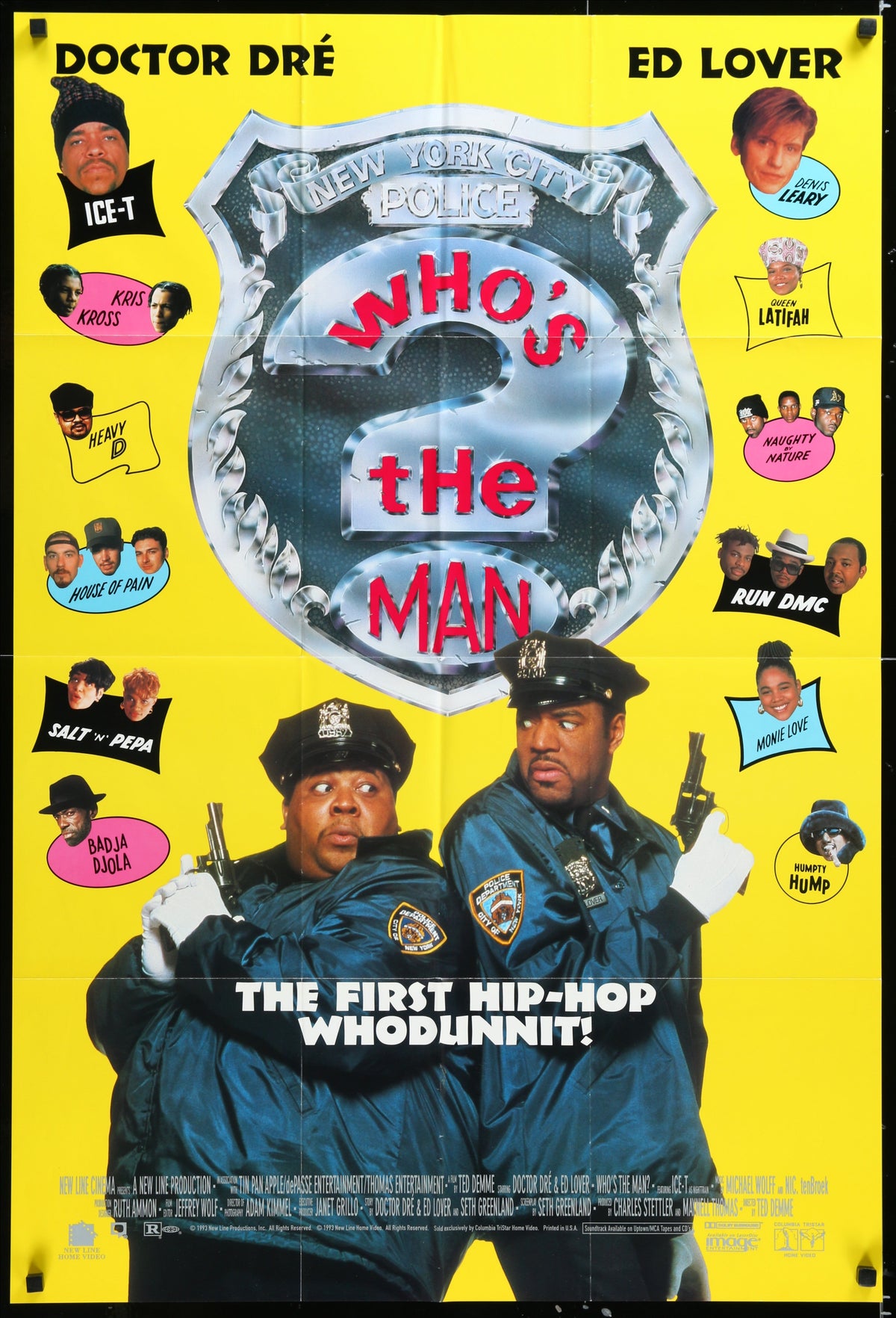 Vibrant yellow who’s the man 1993 movie poster showing two police officers in blue uniforms with metallic shield emblem
