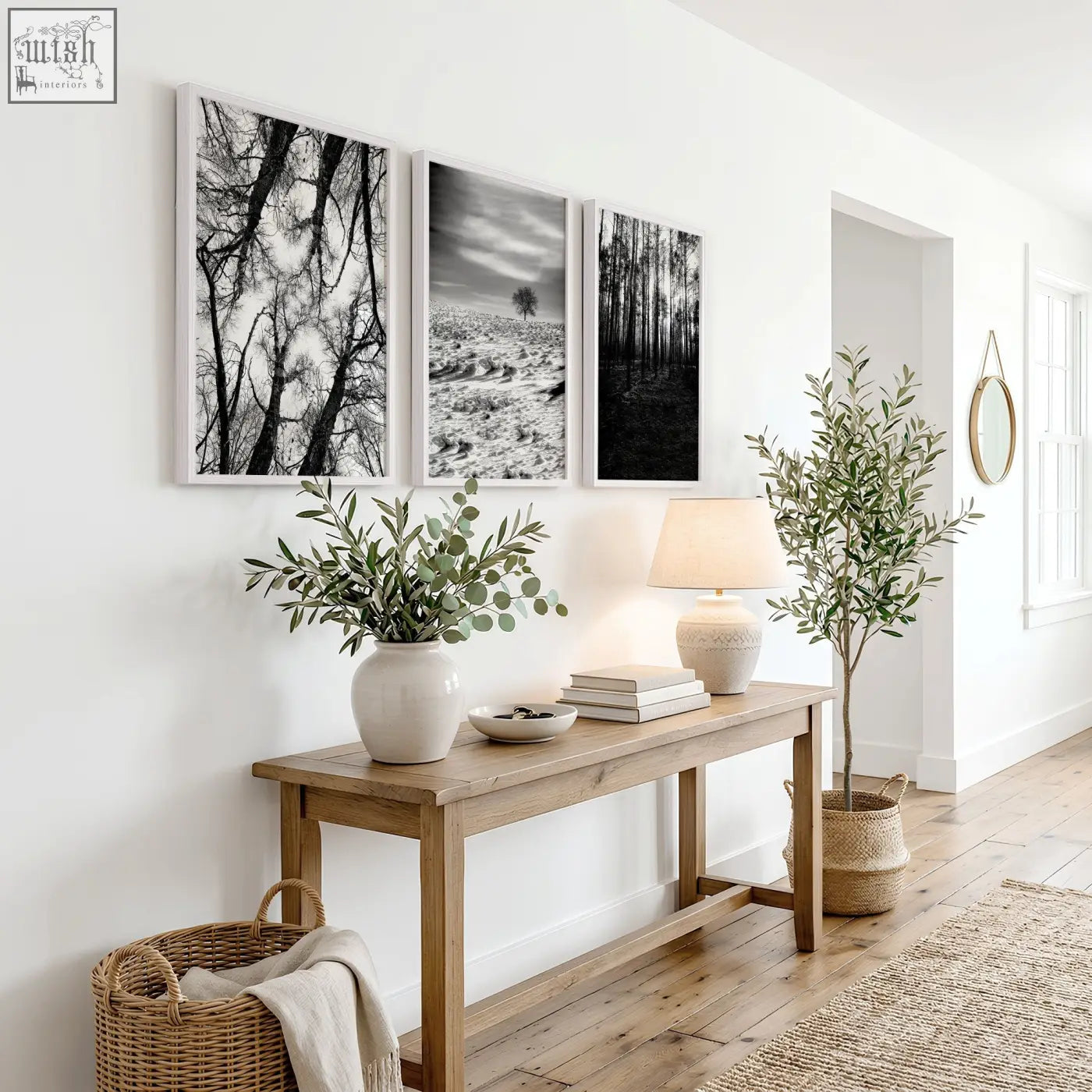 Minimalist wooden console table with natural finish and clean lines paired with black and white wildlife wall art set of 3