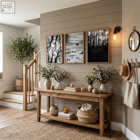 Rustic wooden console table with natural finish and shelves decorated with wildlife wall art black and white forest photos