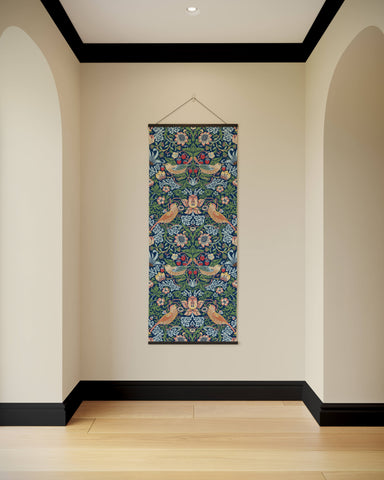 A william morris strawberry thief tapestry with vibrant birds and flowers on a deep green background hanging vertically