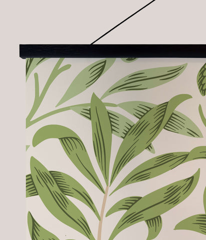 A william morris willow boughs tapestry featuring green stylized leaves on cream in a sleek black frame