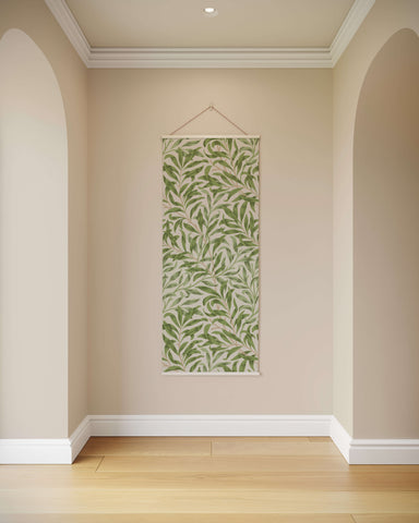 A william morris willow boughs tapestry with green leaf pattern on beige background framed in white border