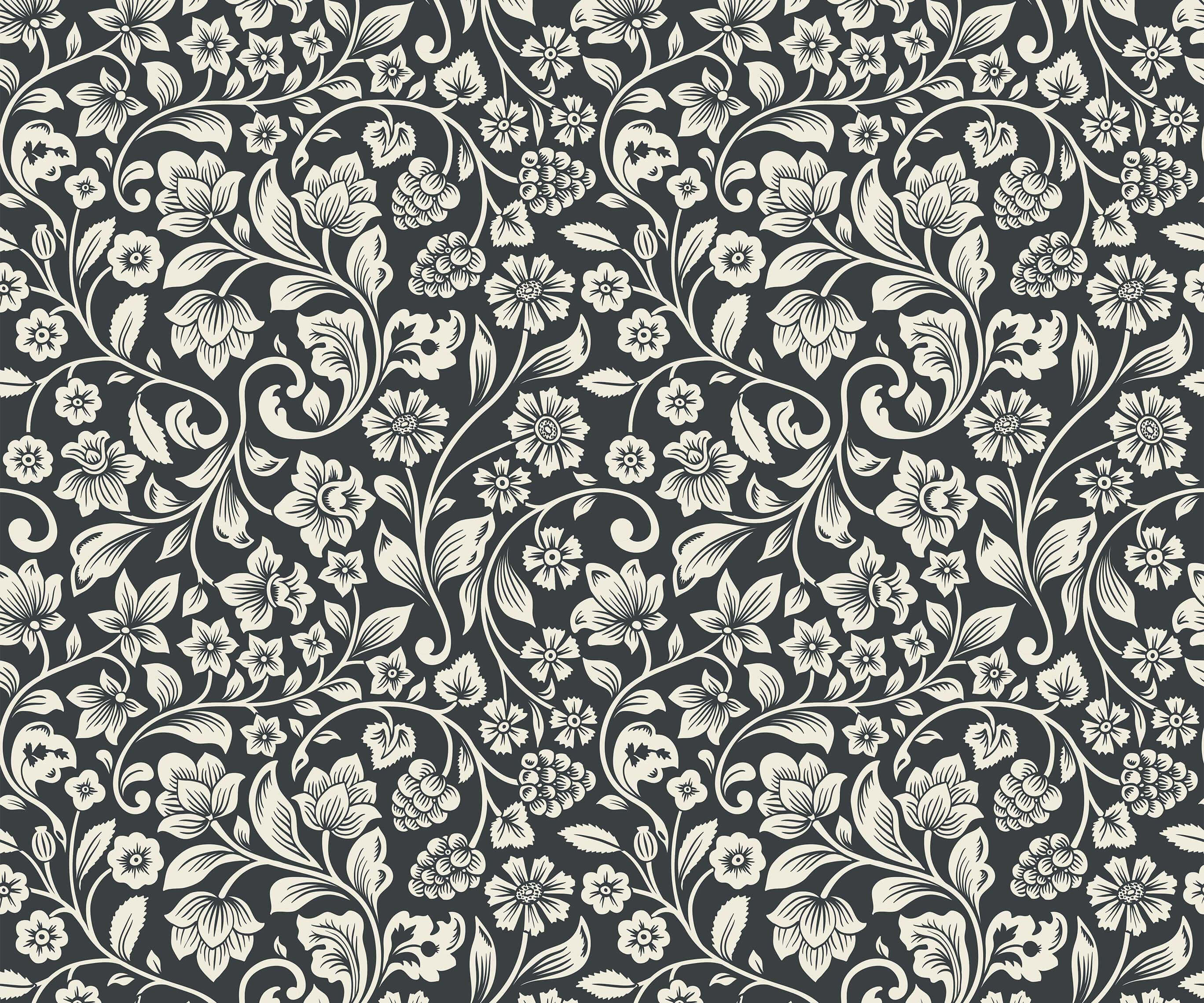 Willow black and white floral wallpaper with intricate repeating vine leaf and blossom patterns for home decor