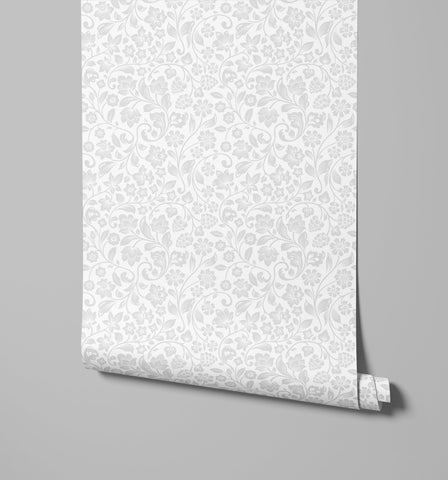 A delicate white willow wallpaper roll with an intricate soft gray floral pattern perfect for stylish interiors